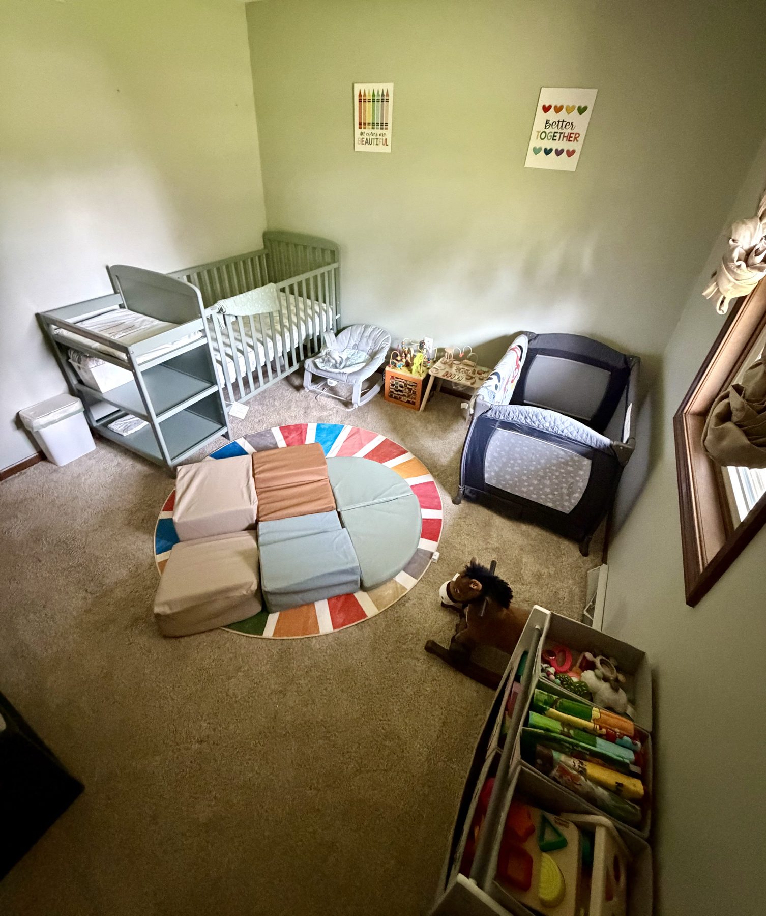 Infant and toddler care space with a cozy rug and seating